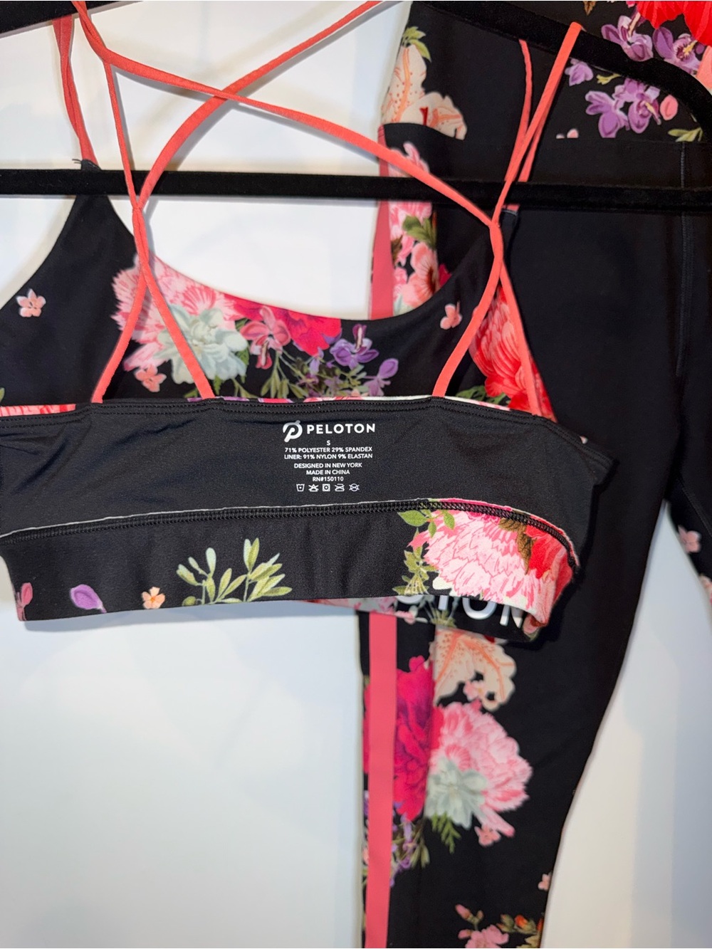 Peloton Black Leggings and Floral Sports Bra Set with Pink Accents - Picture 3 of 5